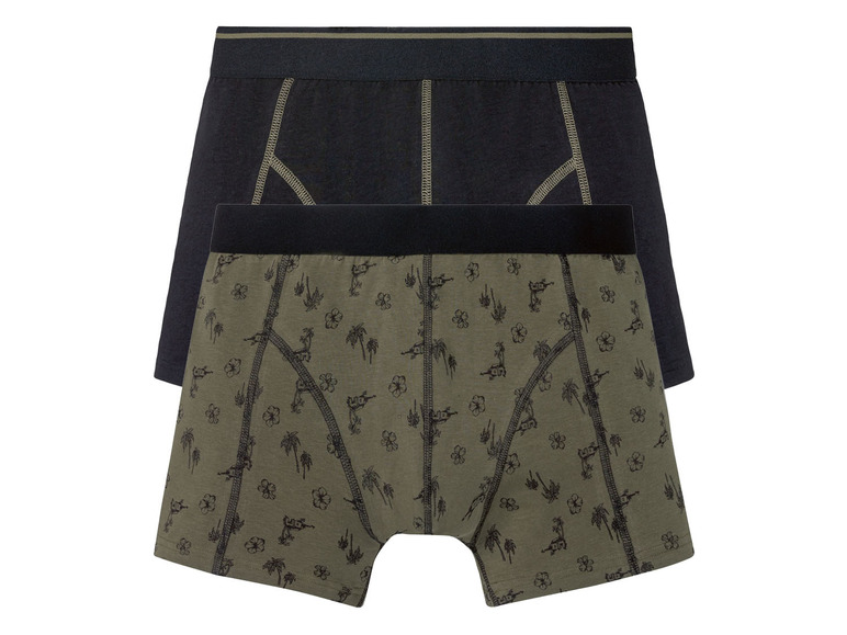 Twee paar boxershorts, een zwart en een met een tropisch printje.