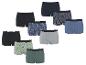 Een assortiment katoenen boxershorts in diverse kleuren en patronen, waaronder ananassen en auto's.