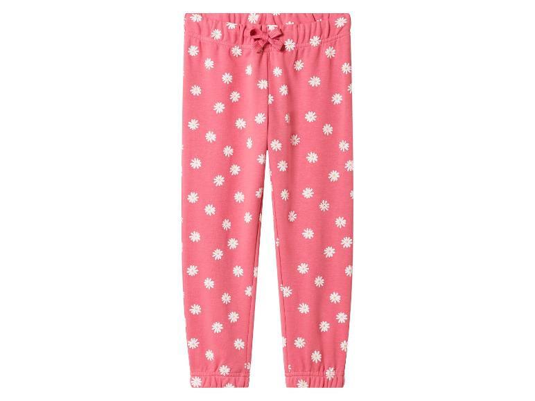 Roze joggingbroek voor kinderen met witte madeliefjes en een roze strik