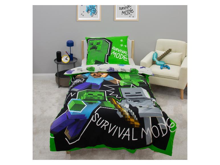 Minecraft-thema beddengoedset met een groen kussen en zwart dekbed, met personages en de tekst 'SURVIVAL MODE'.