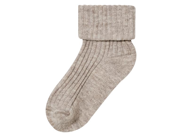 Beige wollen sok met geribbelde boord.