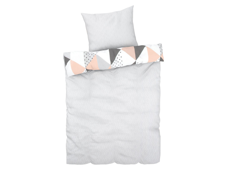 Beddengoed met een grijze en roze geometrisch patroon.