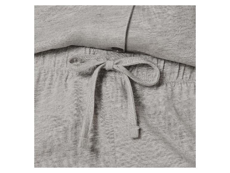 Close-up van lichtgrijze melange loungewear-stof met een gestrikte trekkoord.