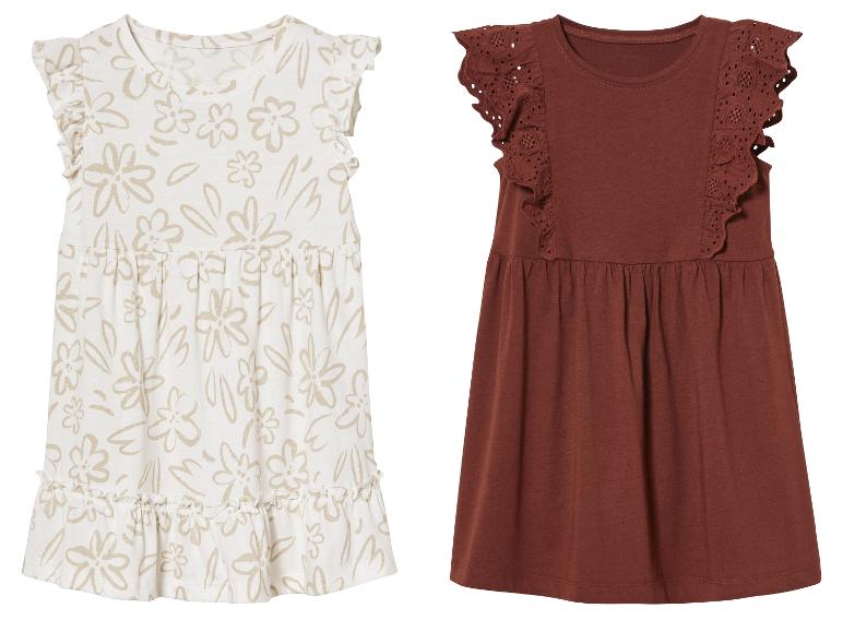 Twee meisjesjurkjes: een beige jurkje met bloemenprint en een donkerbruin jurkje met kant.