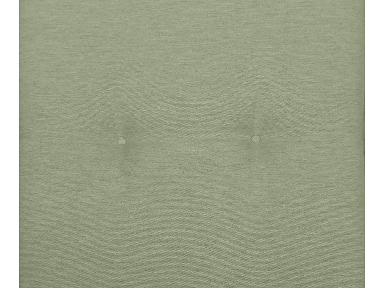 Close-up van een groene stoffen bekleding.