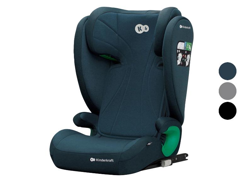 Donkerblauw kinderautostoeltje met groene accenten en drie kleurstalen.