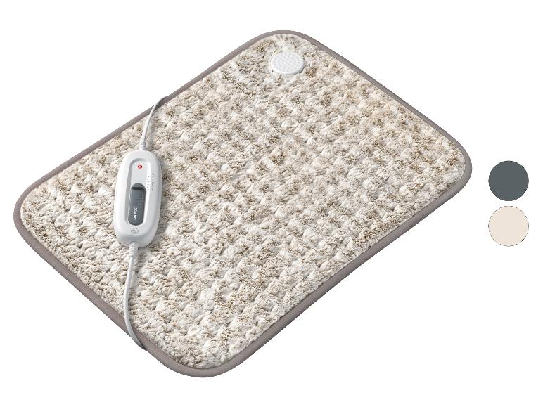 Pluizige elektrische deken met afstandsbediening en warmte-instellingen.