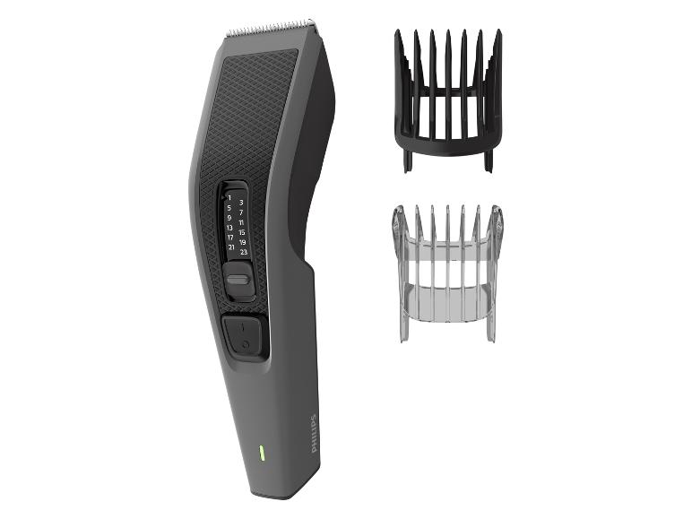 Haartrimmer met instelbare lengte en twee opzetkammen.