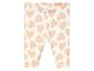 Witte leggings met roze hartjes print.
