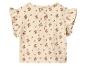 Beige babytop met bloemenpatroon en ruchesmouwen, knopen op de rug.