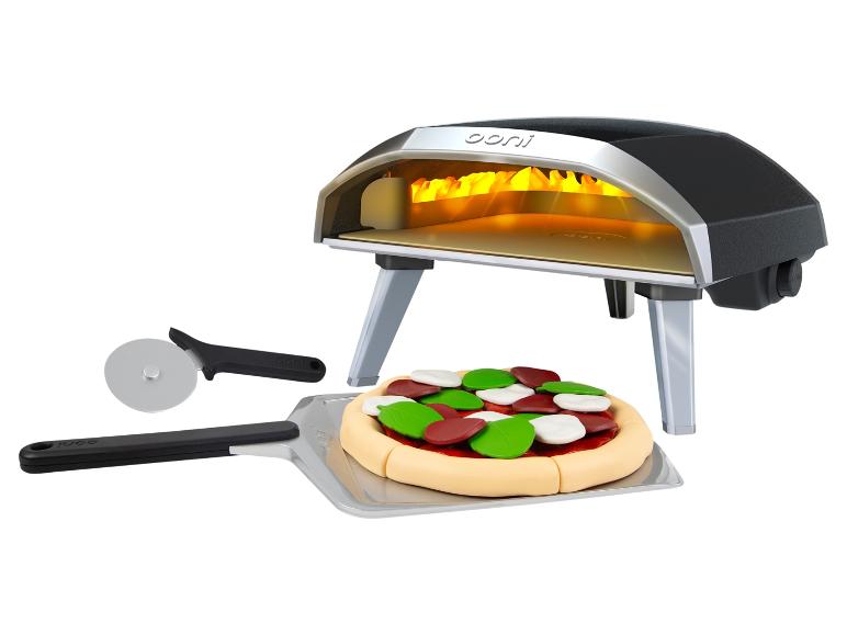 Pizzaoven met pizzasnijder, schep en speelgoedpizza