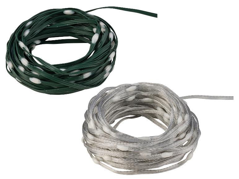 Twee opgerolde LED-lichtsnoeren, één groen en één zilverkleurig.