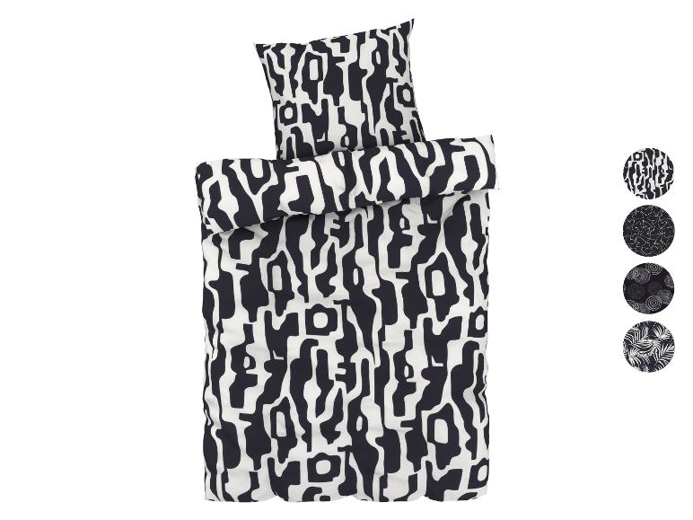 Een zwart-wit dekbedovertrek met een abstract patroon.