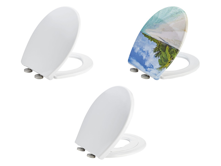 Toiletbrillen in wit en met een tropisch strandthema.