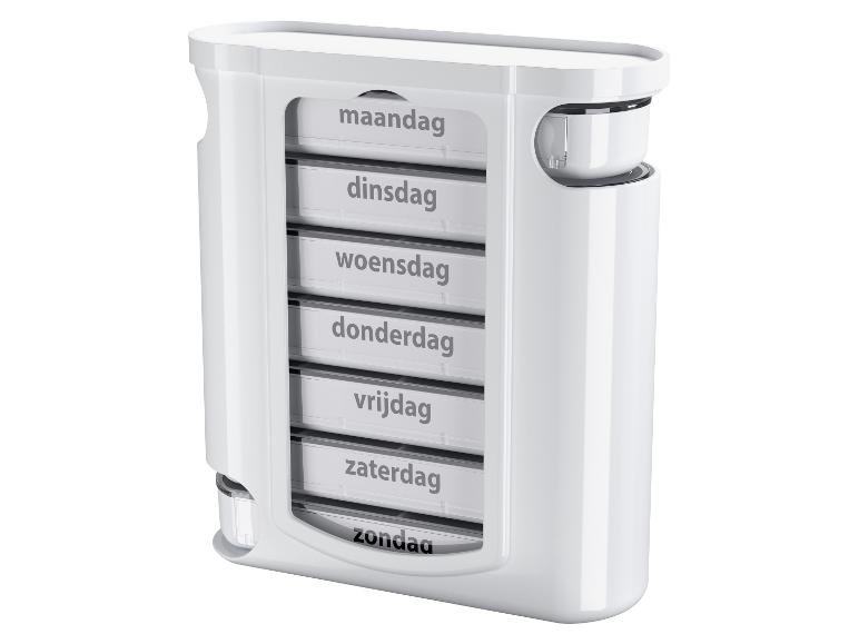 Witte wekelijkse pillendoos met compartimenten gelabeld met de dagen van de week in het Dutch.