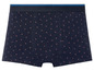 Donkerblauwe boxershorts met rode stippen.