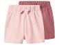 Twee paar baby shorts in roze en donkerroze met elastische tailleband en een strik.