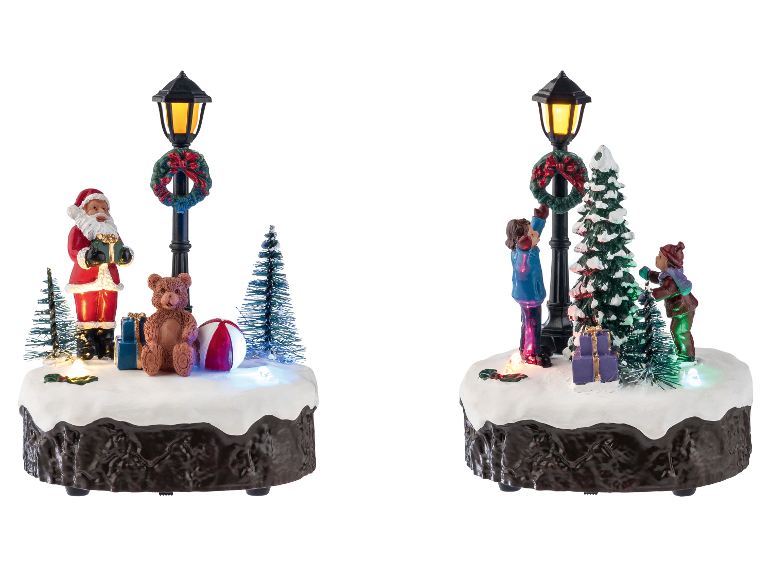 LIVARNO home LED-kerstdorpfiguren met verlichte lantaarnpalen en feestelijke taferelen.