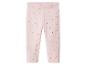 Roze kinderlegging met rode stippen.