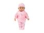 Babypop in roze pyjama met hartjes en rozen.