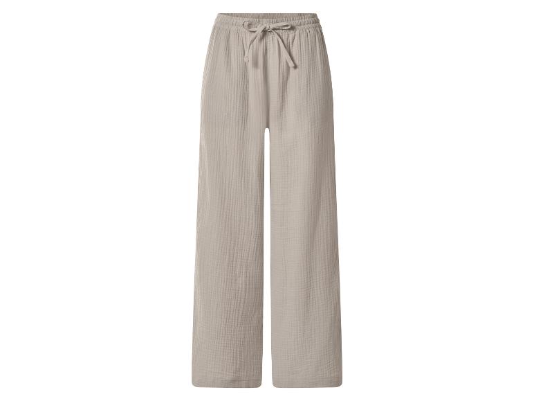 Beige wijde mousseline broek met elastische taille en trekkoord.