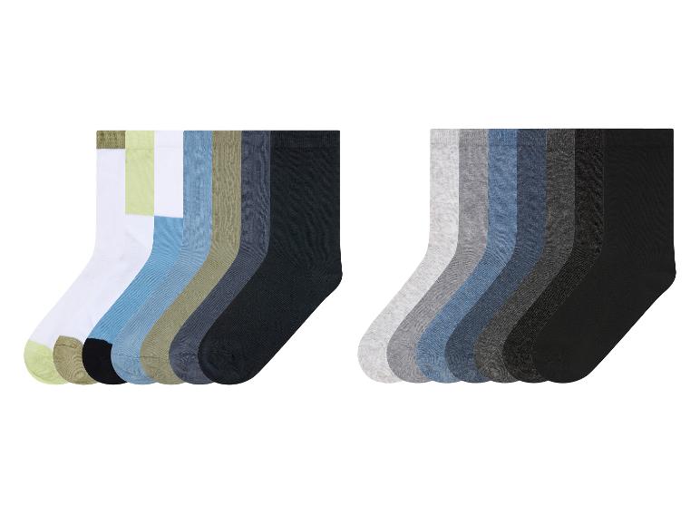 Een set van 12 sokken in verschillende kleuren, waaronder zwart, grijs en blauw.