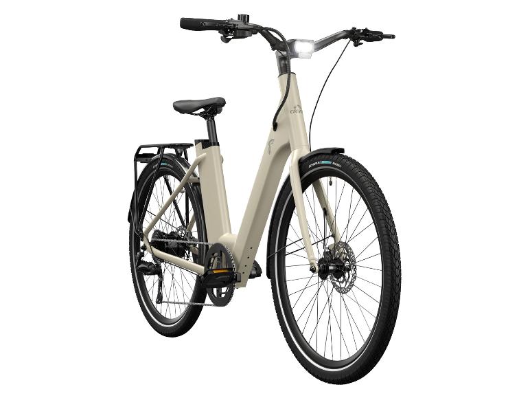 Een beige elektrische fiets met Schwalbe Big Ben banden.
