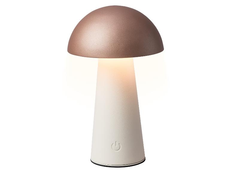 Paddestoelvormige tafellamp met roségouden bovenkant en witte voet, die warm licht uitstraalt.