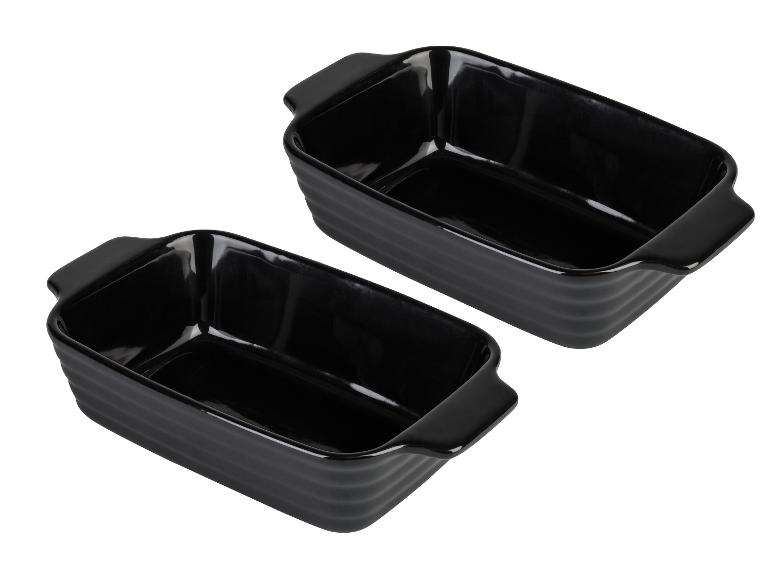 Twee zwarte rechthoekige ovenschaaltjes met handvatten.