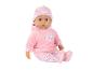 Babypop in een roze outfit met hart- en rozenpatronen