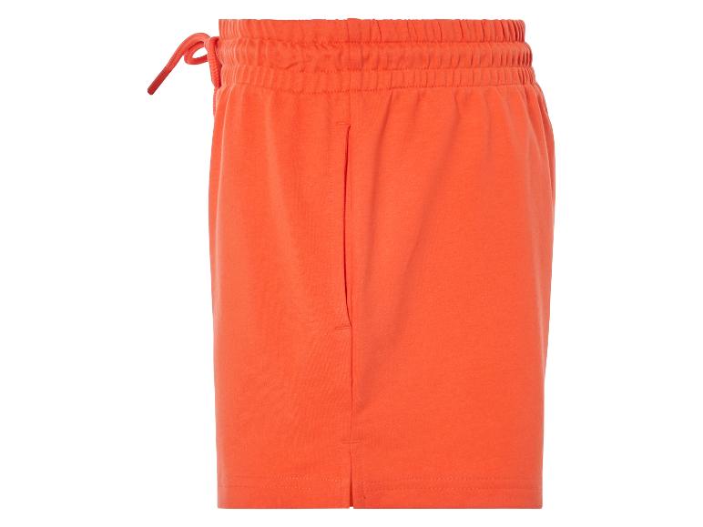 Oranje katoenen shorts met trekkoord.