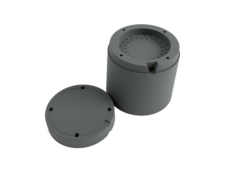 Grijze cilindrische behuizing met apart deksel.