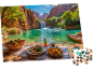 Een legpuzzel van een idyllische picknick aan een turquoise meer met een waterval.