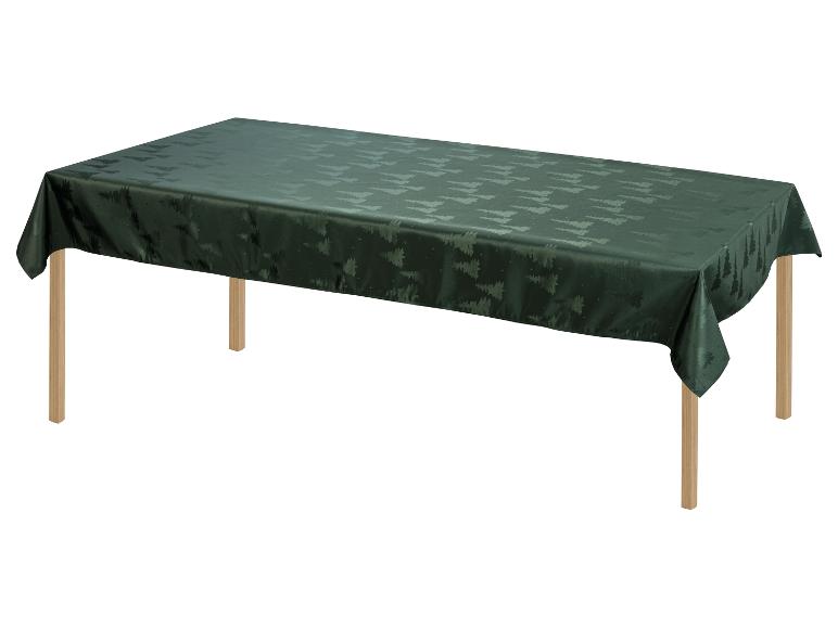 Een donkergroen tafelkleed met een kerstboompjespatroon.