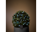 Op zonne-energie werkende topiary met witte LED-lichtjes in een donkergrijze pot.