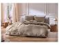 LIVARNO home mousseline beddengoed in taupe op een modern bed.