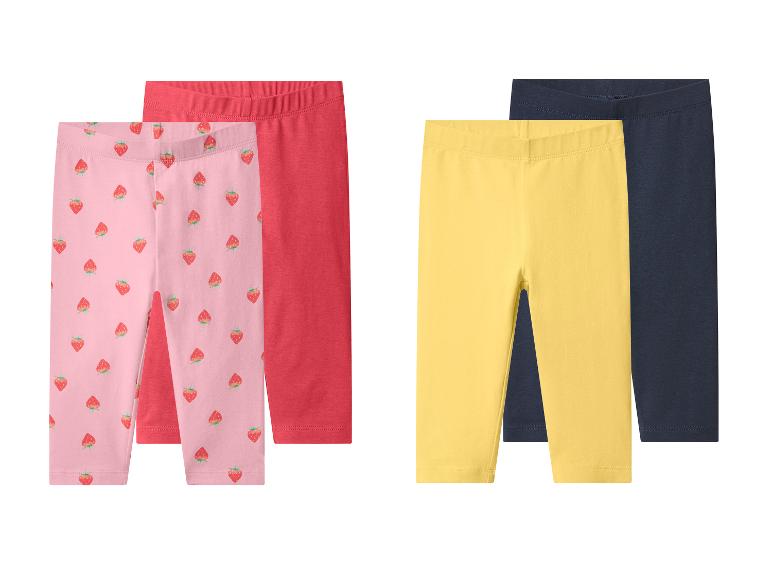 Set van twee meisjesleggings: roze met aardbeien en rood, plus geel en donkerblauw.