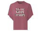 Een roze T-shirt met de tekst 'Think Happy Thoughts' in vintage stijl.
