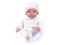 Een babypop met een roze muts en een romper met olifanten.