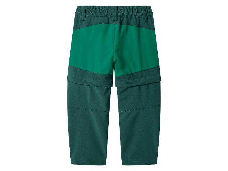 Groene kinderbroek met rits die verandert in een korte broek