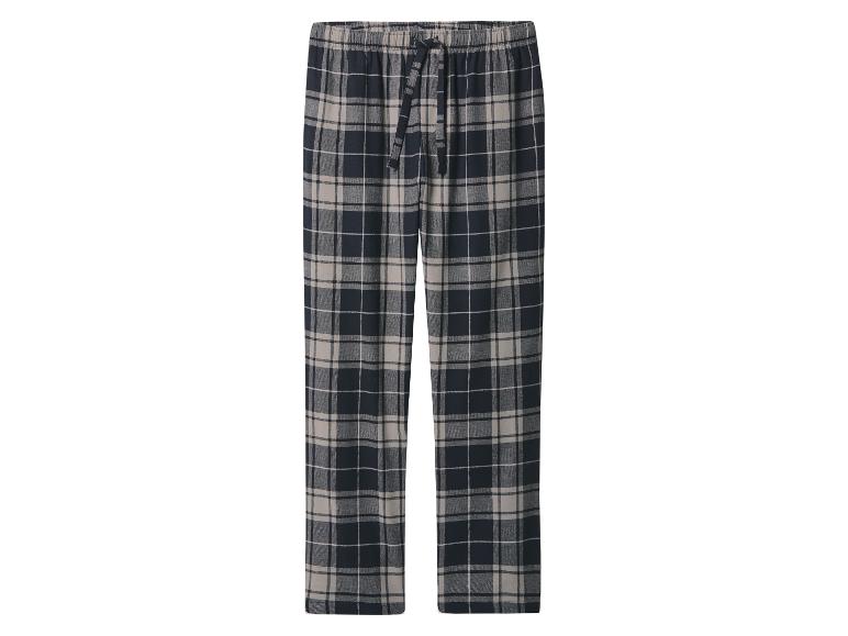 Zwarte en beige geruite pyjamabroek.