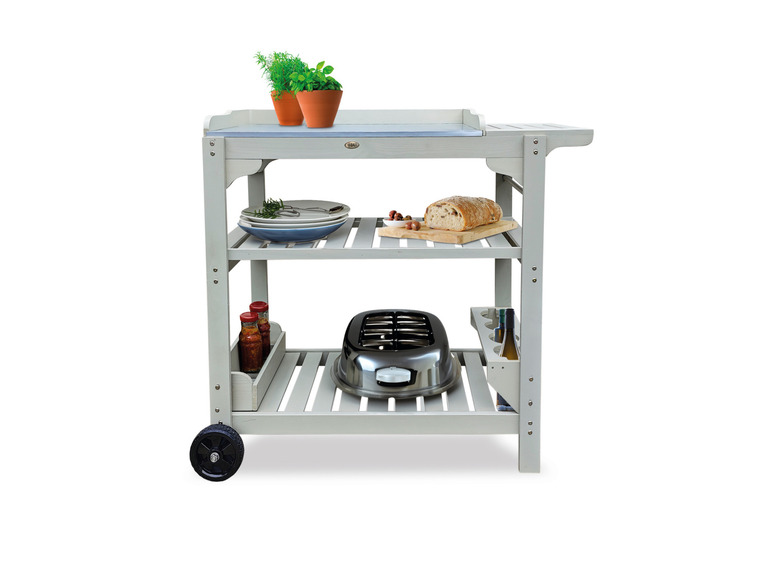 Een wit houten serveerwagentje met een tooster, borden en een brood.