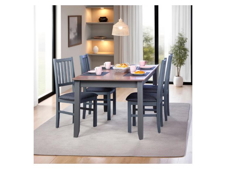 Eetkamer: tafel en vier grijze stoelen.