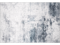 Abstract patroon vloerkleed in grijs en wit.