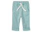 Babyblauwe broek met witte touwtjes