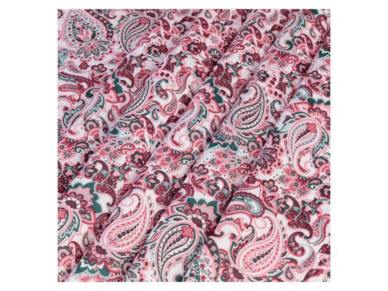 Stof met een roze en groene paisley print.