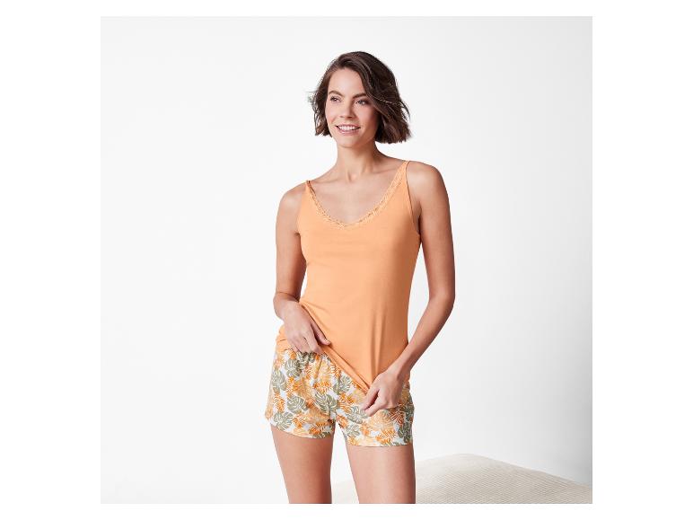Nachthemd en short: oranje top en short met tropische bladerprint.