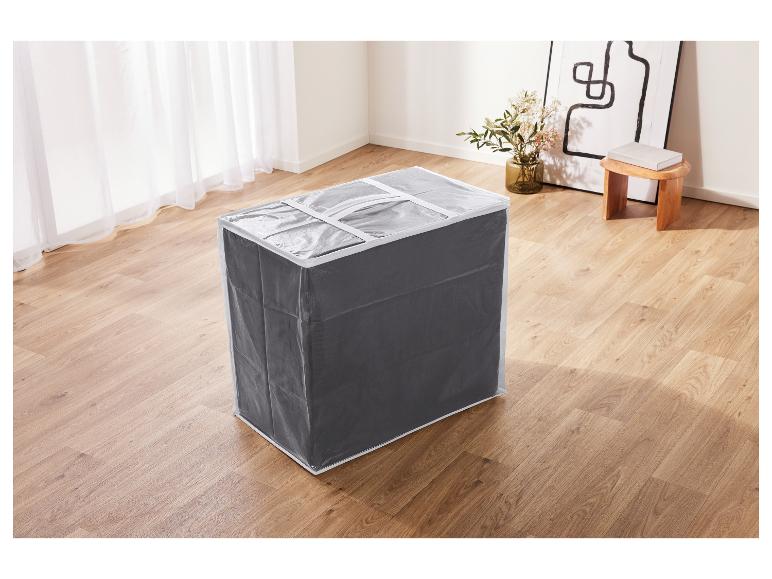 Grijze stoffen opbergdoos met doorzichtige hoes in een kamer