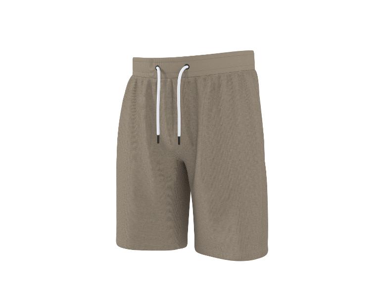 Kakikleurige joggingbroek met wit trekkoord.