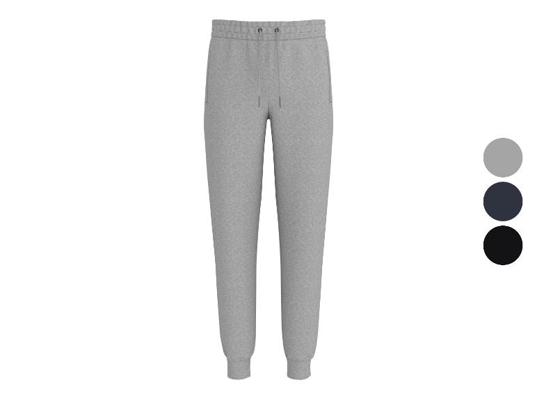 Grijze joggingbroek met trekkoord en zakken, verkrijgbaar in drie kleuren.